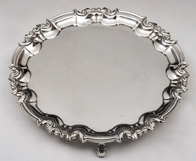 Appraisal: A LATE VICTORIAN SILVER SALVER with a scroll and shaped