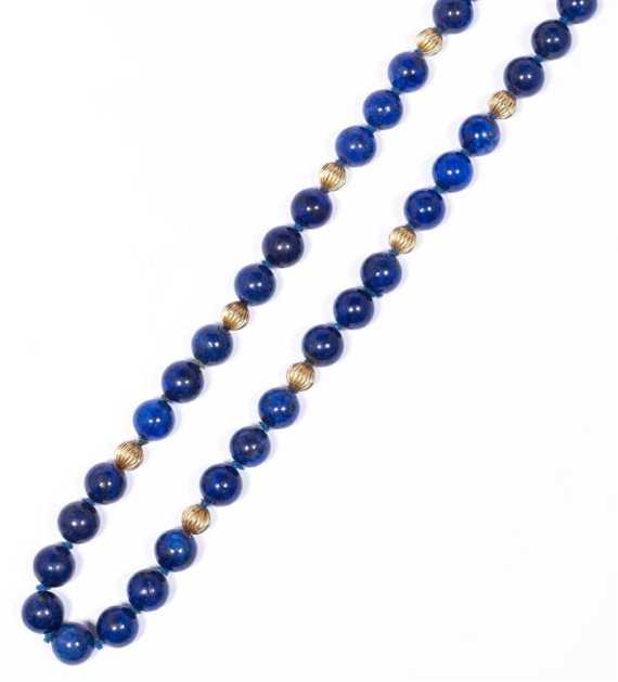 Appraisal: LAPIS LAZULI AND GOLD SAUTOIR Endless sautoir of lapis lazuli