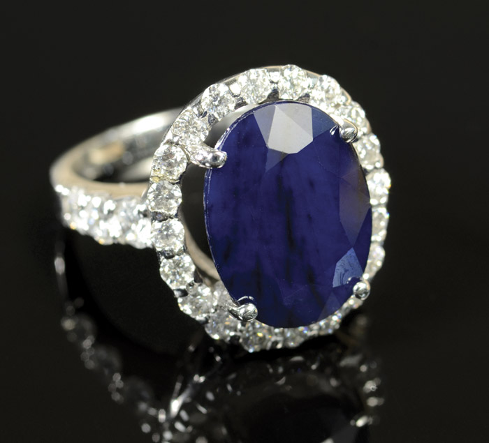 Appraisal: SAPPHIRE DIAMOND AND FOURTEEN KARAT WHITE GOLD RING with round-cut