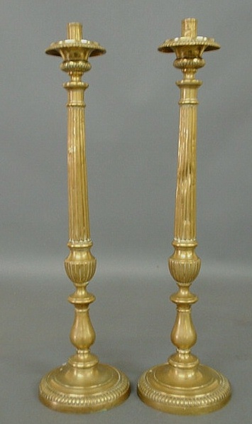 Appraisal: Pair of tall brass candlesticks th c possibly Russian h