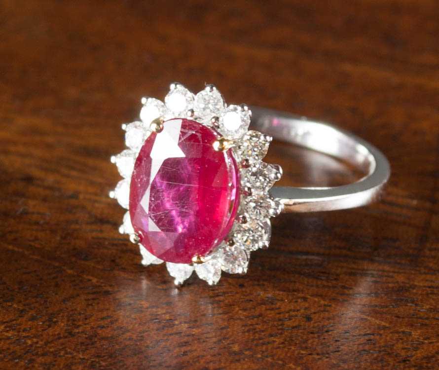 Appraisal: RUBY DIAMOND AND FOURTEEN KARAT GOLD RING The white and