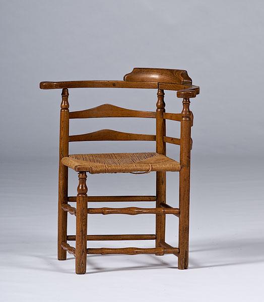 Appraisal: ENGLISH OAK CORNER CHAIR a vernacular corner chair th century