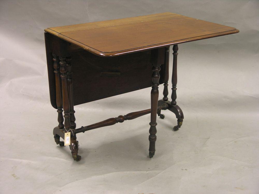 Appraisal: A Victorian mahogany Sutherland table on twin turned end supports