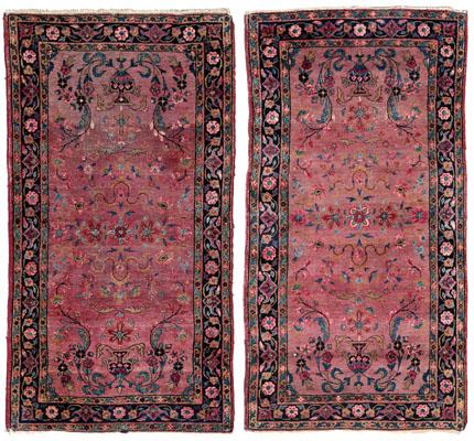 Appraisal: Pair Sarouk rugs both with symmetrical vase designs with vines