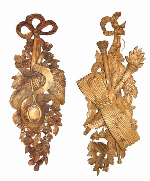 Appraisal: A pair of carved wall plaques height in width in