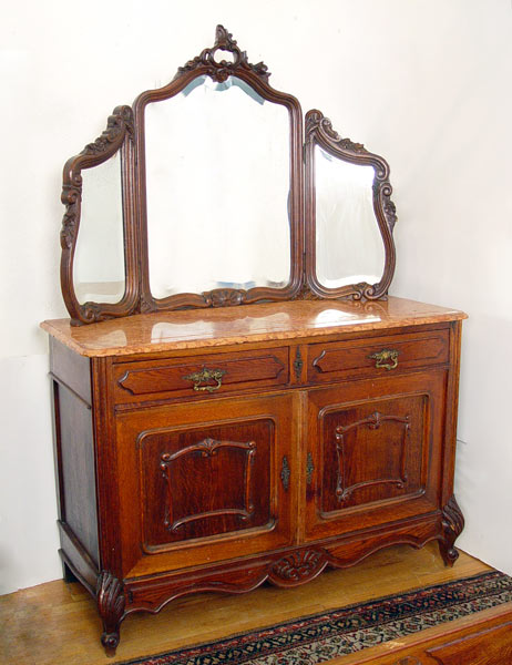 Appraisal: FRENCH OAK MARBLE TOP DRESSER WITH TRIPLE MIRRORS Pink red