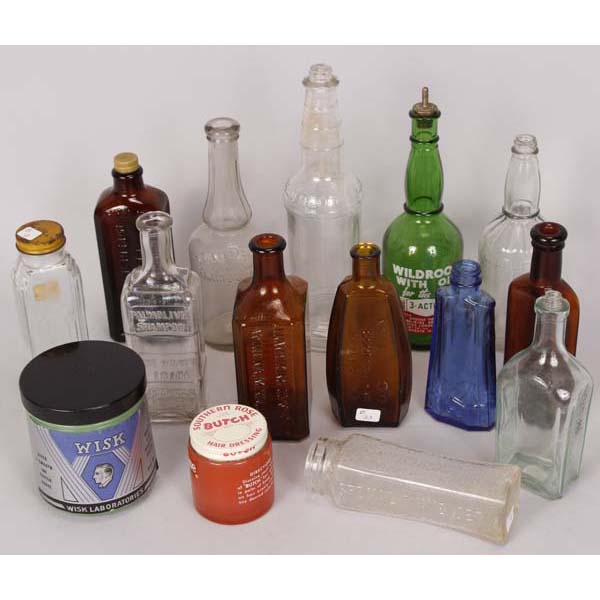 Appraisal: Sixteen glass barber bottles and Jadeite jar with embossed pyro