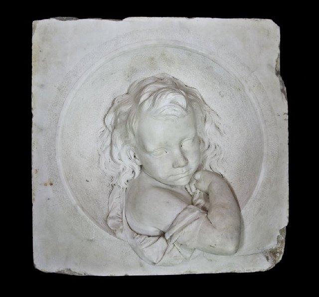 Appraisal: A marble plaque of child in high relief signed F