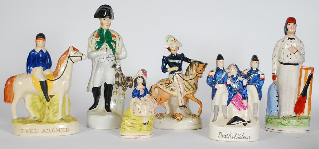 Appraisal: SIX STAFFORDSHIRE POTTERY FIGURES comprising Napoleon in high Cricketer in