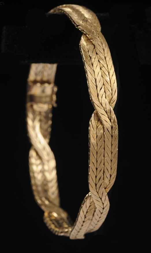 Appraisal: BRAIDED GOLD BRACELET Stamped and signed Revetto approx in oz