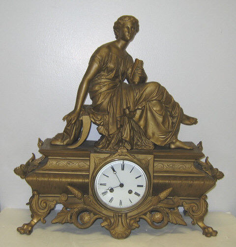 Appraisal: GILT METAL FIGURAL MANTEL CLOCK Table form case with mounted