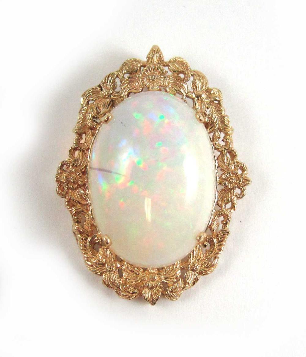 Appraisal: OPAL AND FOURTEEN KARAT GOLD PENDANT with four yellow gold