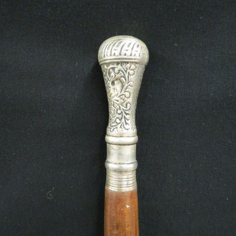 Appraisal: Smugglers Walking Stick ornate silver top uncrews for storage