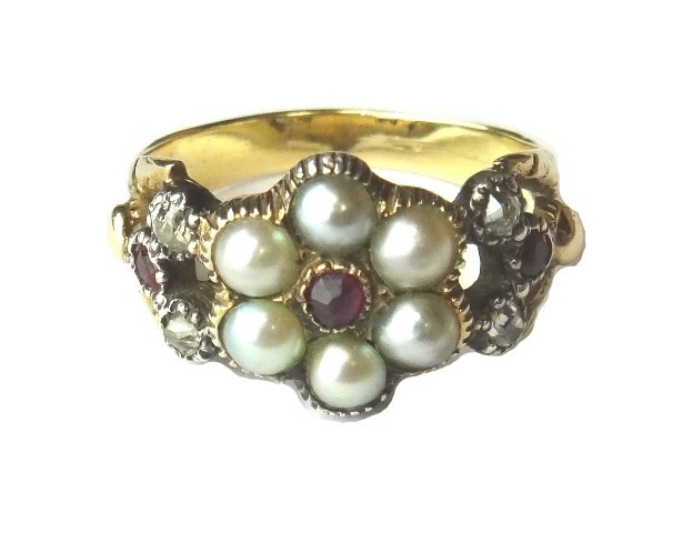 Appraisal: A gold diamond ruby and half pearl set cluster ring