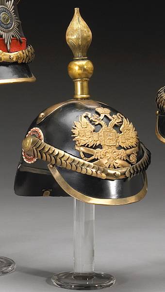 Appraisal: An Imperial Russian spiked helmet The black leather helmet with