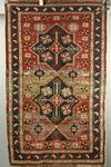 Appraisal: RUG - x Antique Kazak ca two medallions navy field