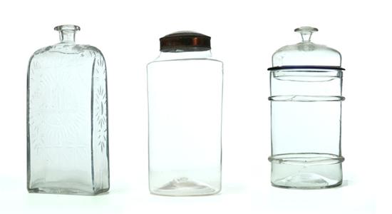 Appraisal: CASE BOTTLE AND TWO GLASS CANISTERS American th century blown