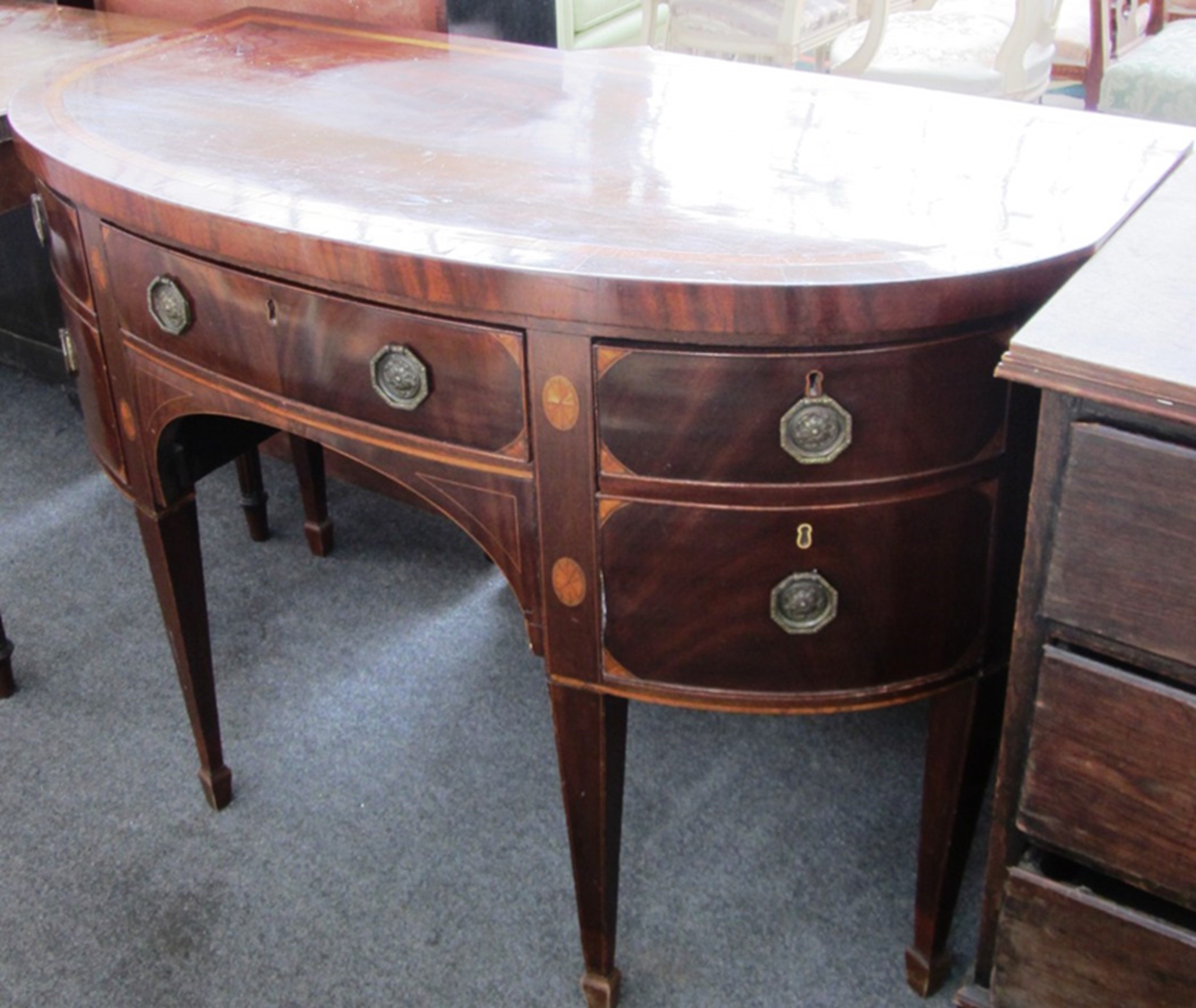 Appraisal: A George III inlaid mahogany bowfront sideboard with five frieze