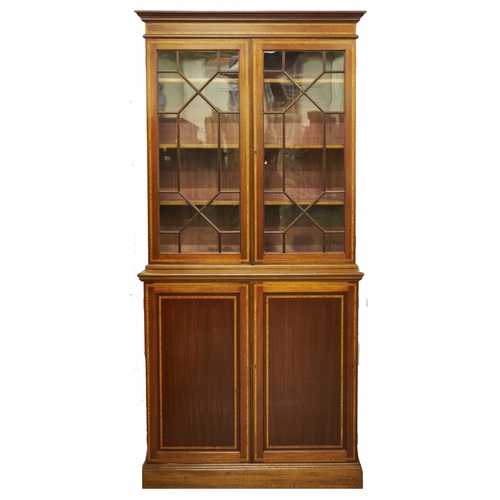 Appraisal: An Edwardian mahogany bookcase crossbanded in satinwood and line inlaid