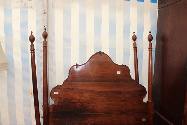 Appraisal: A ROSEWOOD SINGLE BED HEAD AND END with scroll decoration