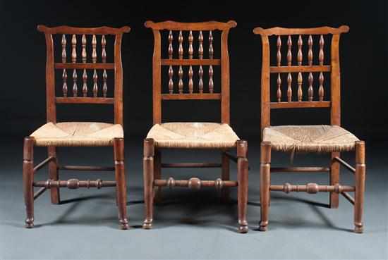 Appraisal: Three Victorian carved elmwood rush-seat Sussex chairs fourth quarter- th