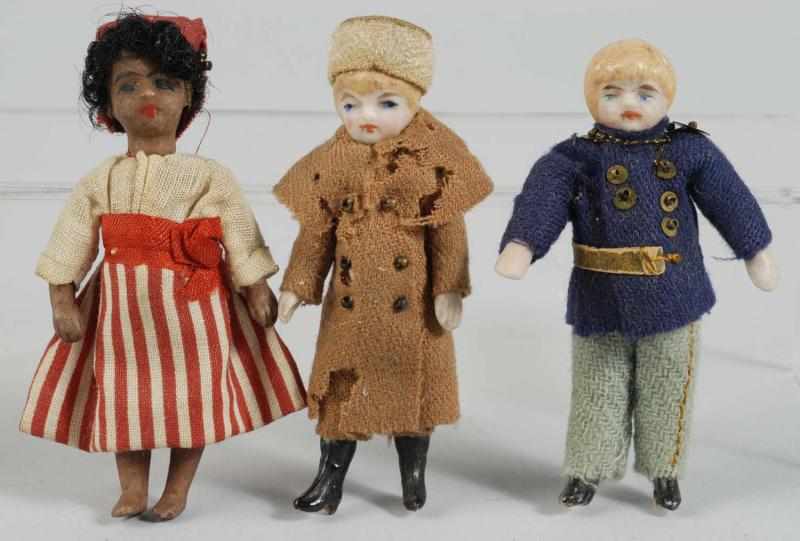 Appraisal: Lot of All Bisque Dolls Description Brown bisque French doll