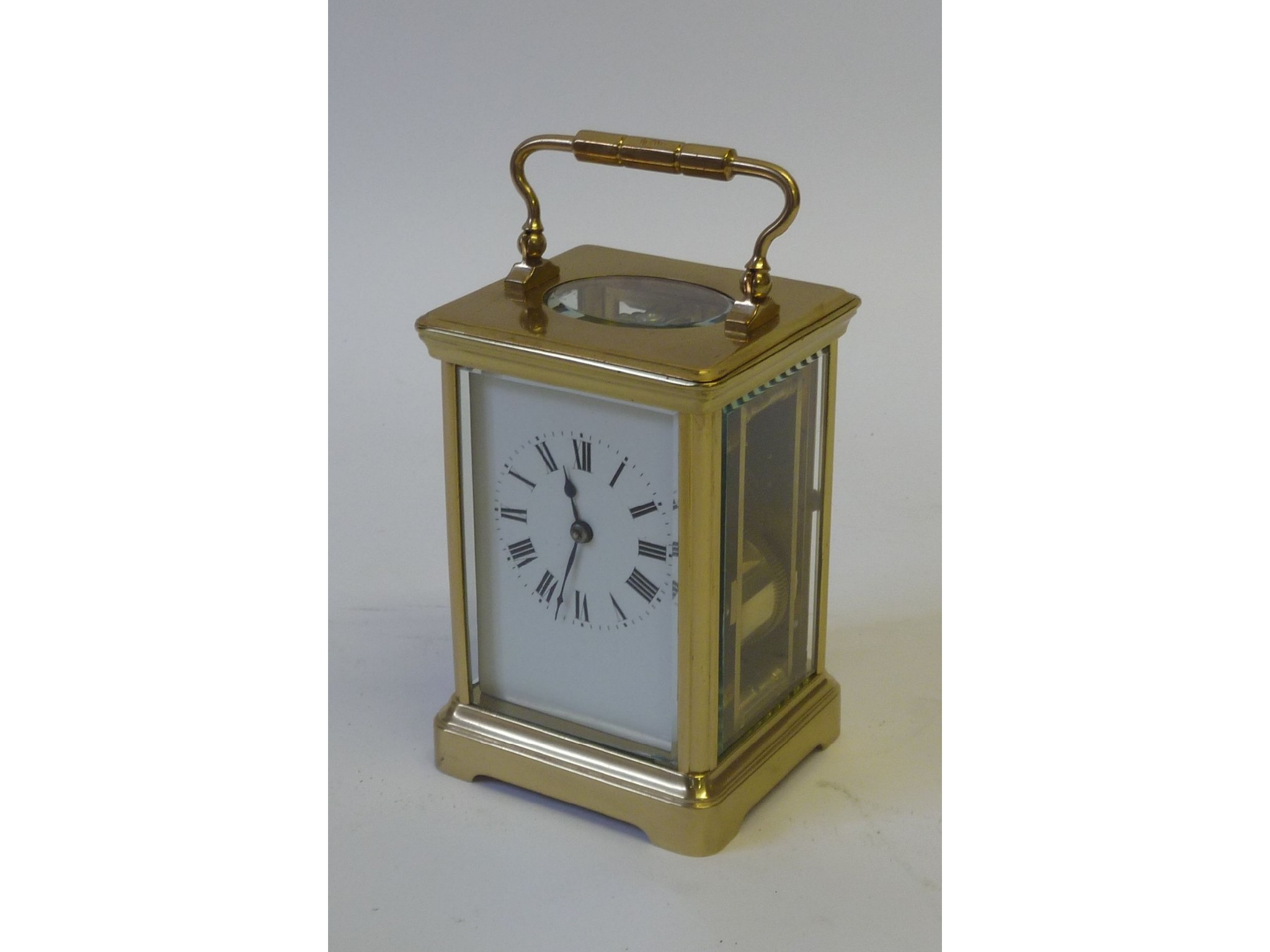 Appraisal: AN EARLY TWENTIETH CENTURY FRENCH BRASS CORNICHE CASED CARRIAGE CLOCK