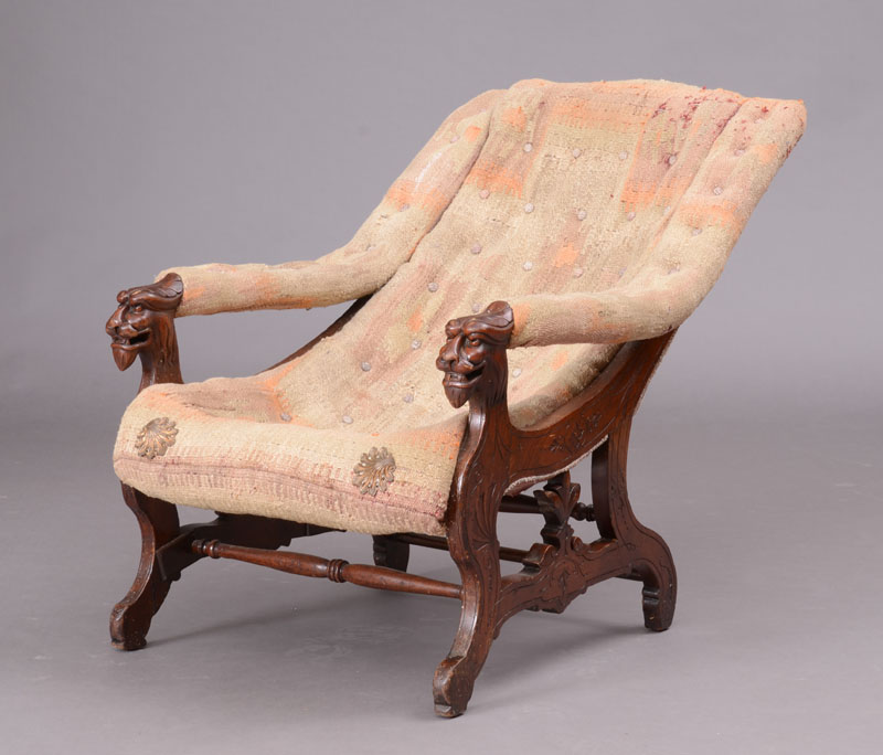 Appraisal: Victorian Carved Mahogany Armchair With upholstered armrests ending in lion