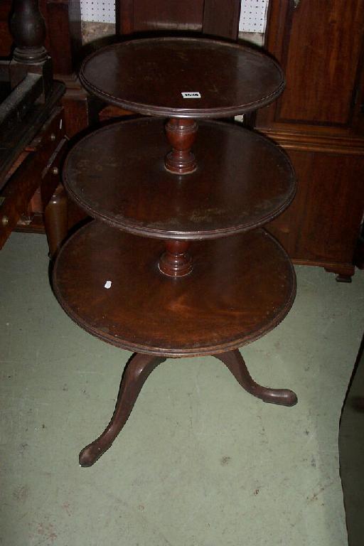 Appraisal: A th century mahogany -tier revolving dumb waiter on turned