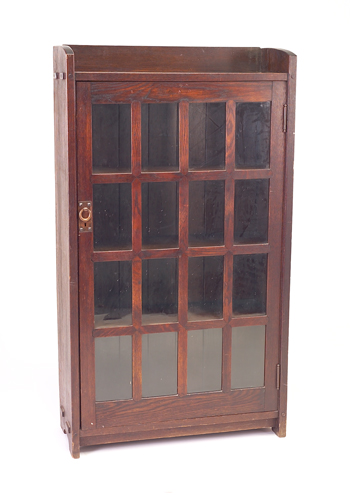 Appraisal: GUSTAV STICKLEY Early mitered-mullion single-door bookcase ca - with gallery