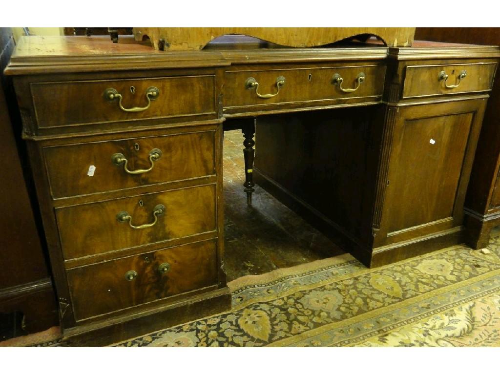 Appraisal: A th century mahogany kneehole pedestal desk the inverted breakfront