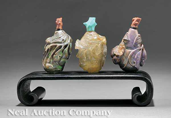 Appraisal: A Group of Three Chinese Hardstone Snuff Bottles each carved