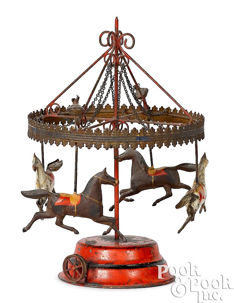 Appraisal: Schoenner painted tin horse carousel Schoenner painted tin horse carousel