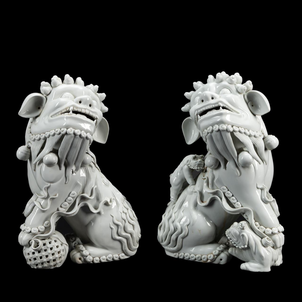 Appraisal: PAIR LARGE BLANC DE CHINE CERAMIC GUARDIAN LIONS Chinese pair