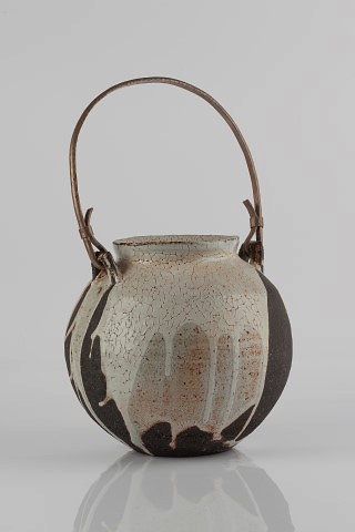 Appraisal: Lisa Hammond British b Jarpoured white shino glaze hammered metal