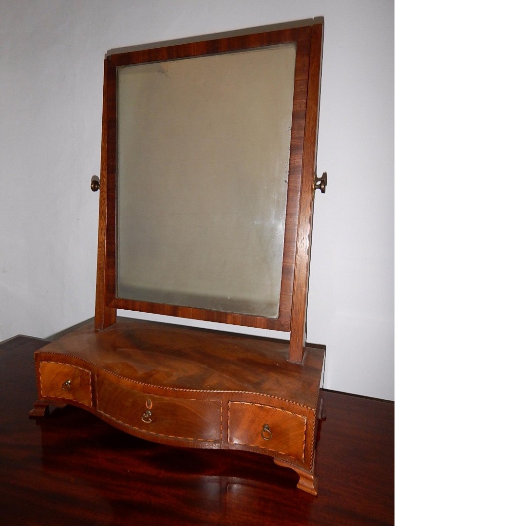 Appraisal: A George III inlaid mahogany serpentine front toilet mirror fitted