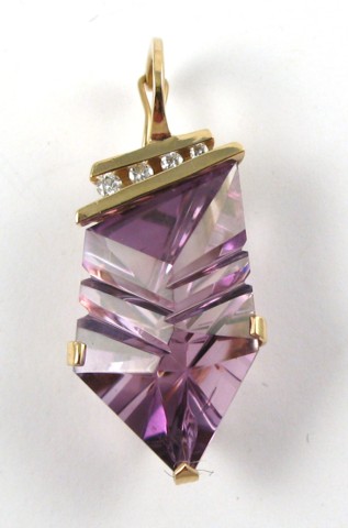 Appraisal: AMETHYST AND FOURTEEN KARAT GOLD PENDANT secured by three gold