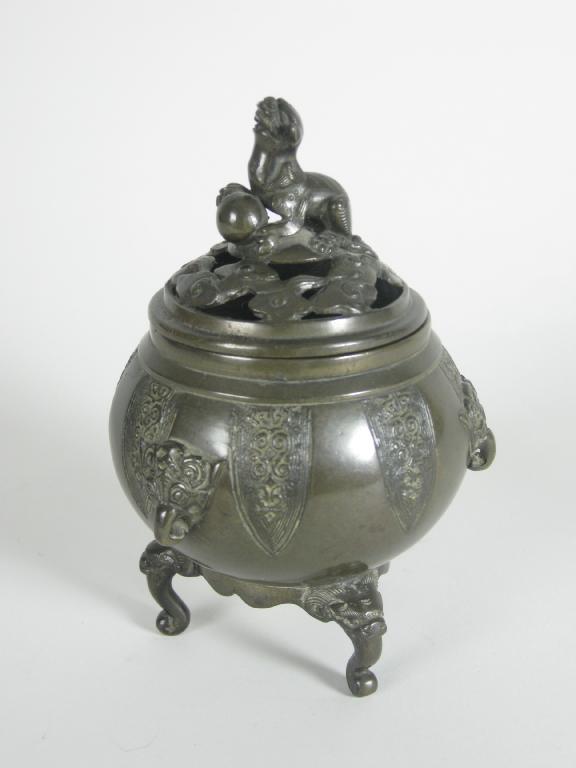 Appraisal: A Chinese bronze Pot Pourri and pierced cover stylised elephant