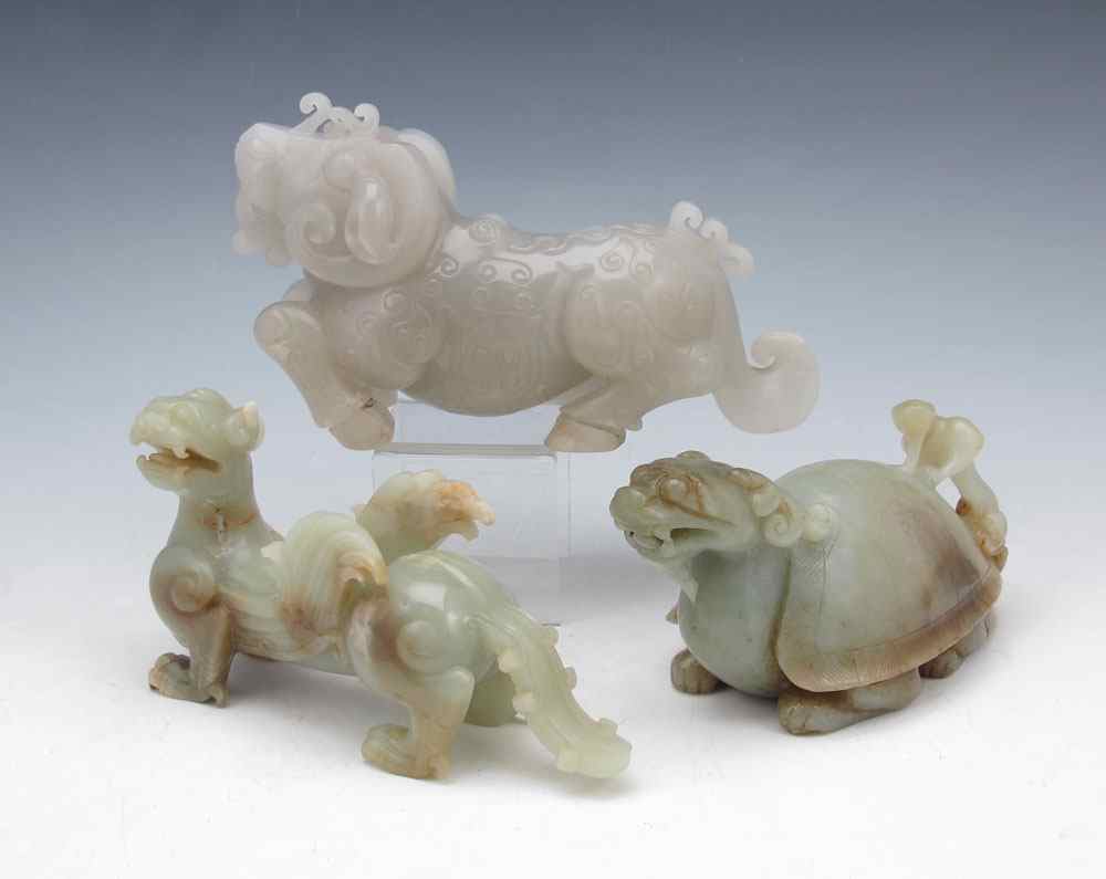 Appraisal: CHINESE HARD STONE FIGURAL CARVINGS Nephrite dragon and mythical beasts