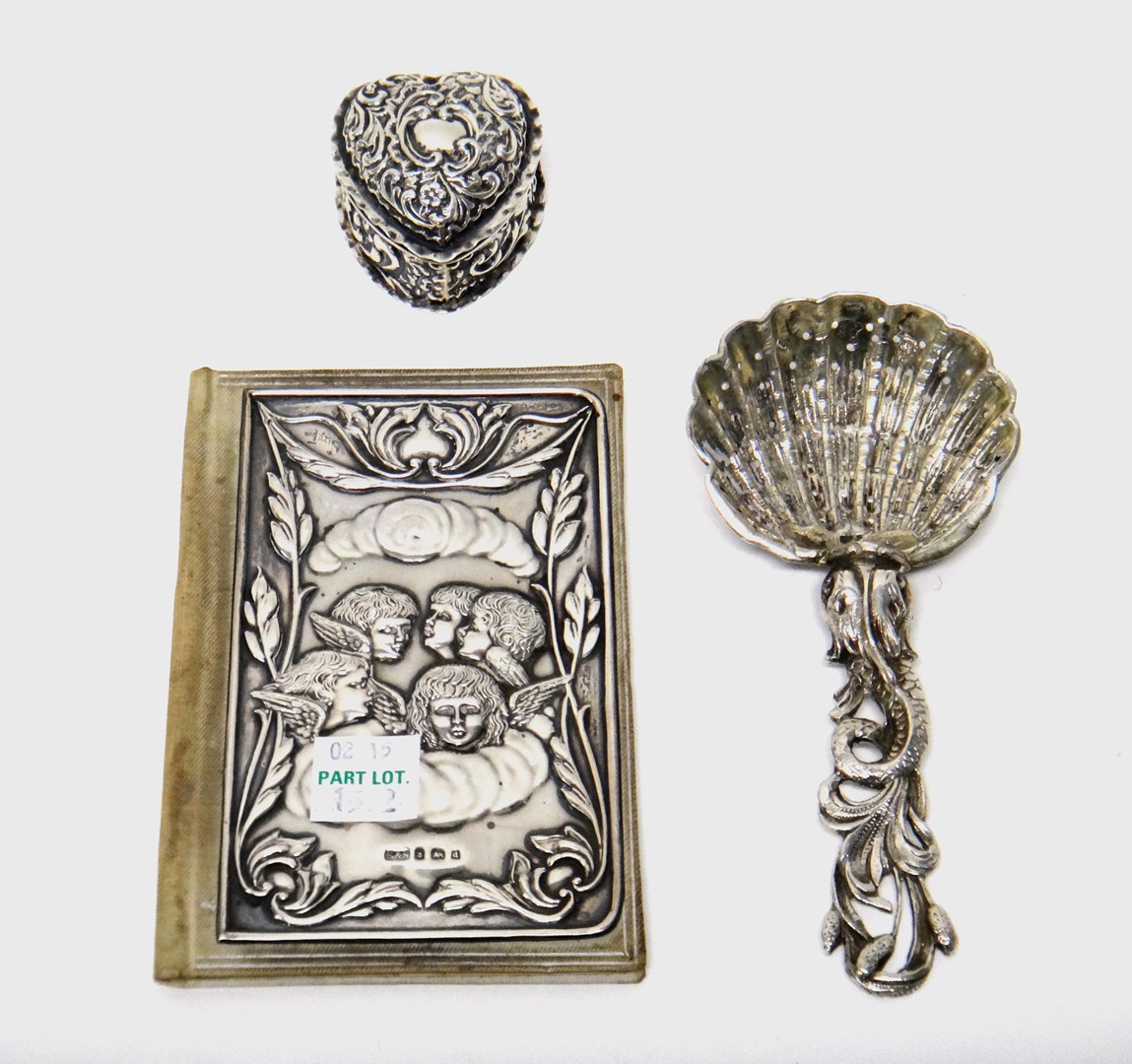 Appraisal: A silver hinge lidded heart shaped trinket box with embossed