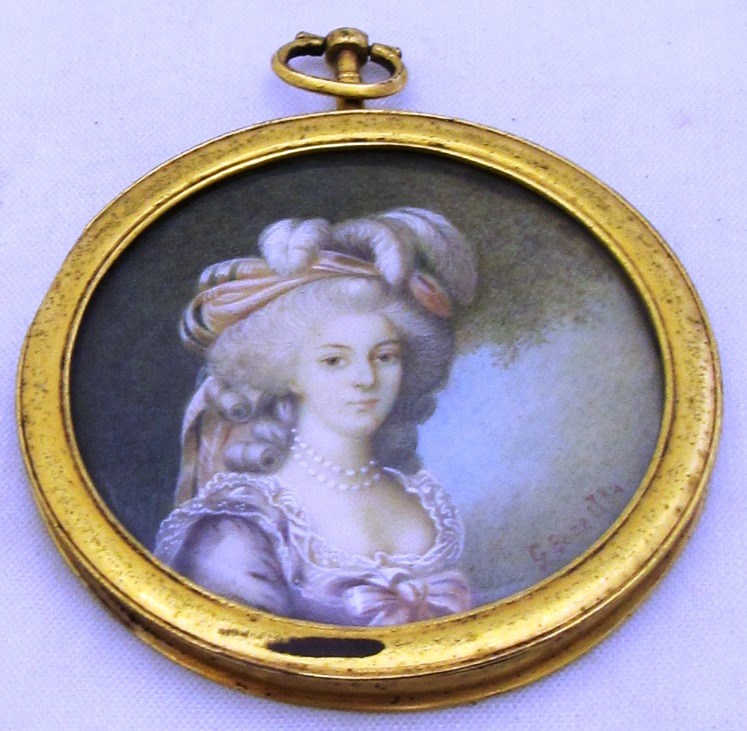 Appraisal: A gilt metal mounted circular portrait miniature of a lady