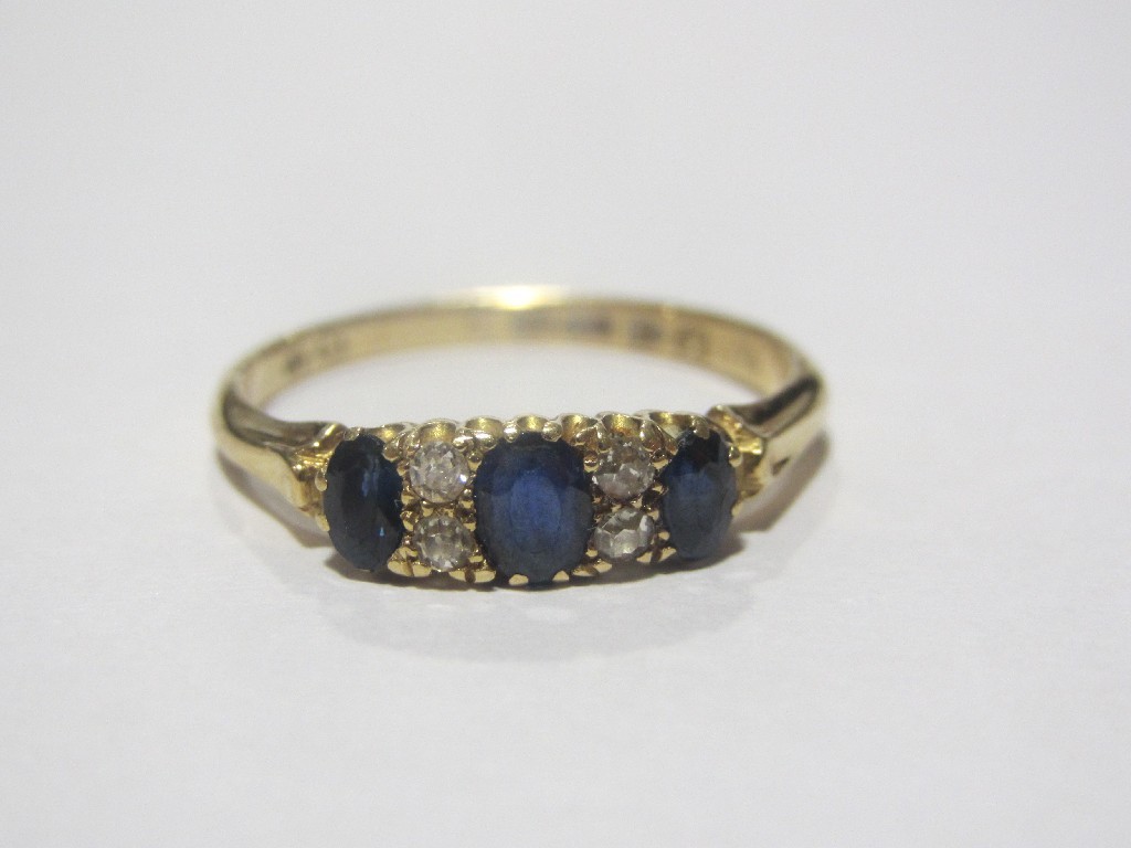 Appraisal: Eighteen carat gold sapphire and diamond set dress ring