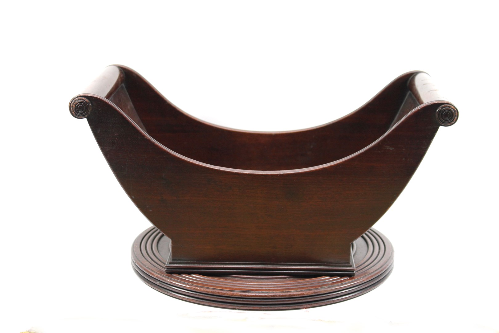 Appraisal: A George III mahogany cheese coaster with turned finials on