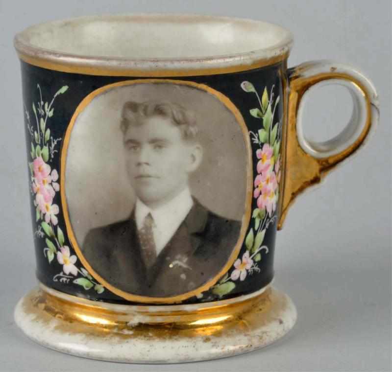 Appraisal: Photographic Shaving Mug Full black wrap Shows a young man