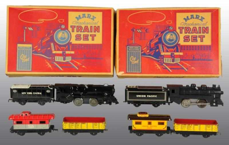 Appraisal: Lot of Tin Marx Steam-Type Wind-Up Train Sets Description Working