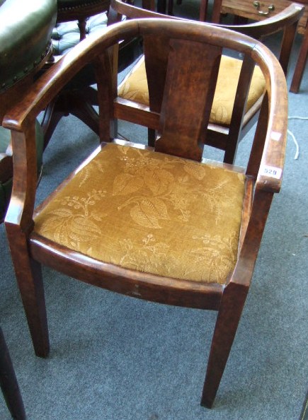 Appraisal: A pair th century faux walnut tub chairs raised on