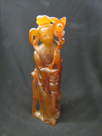 Appraisal: Chinese Carved Amber Figurine of a goddess tall green to