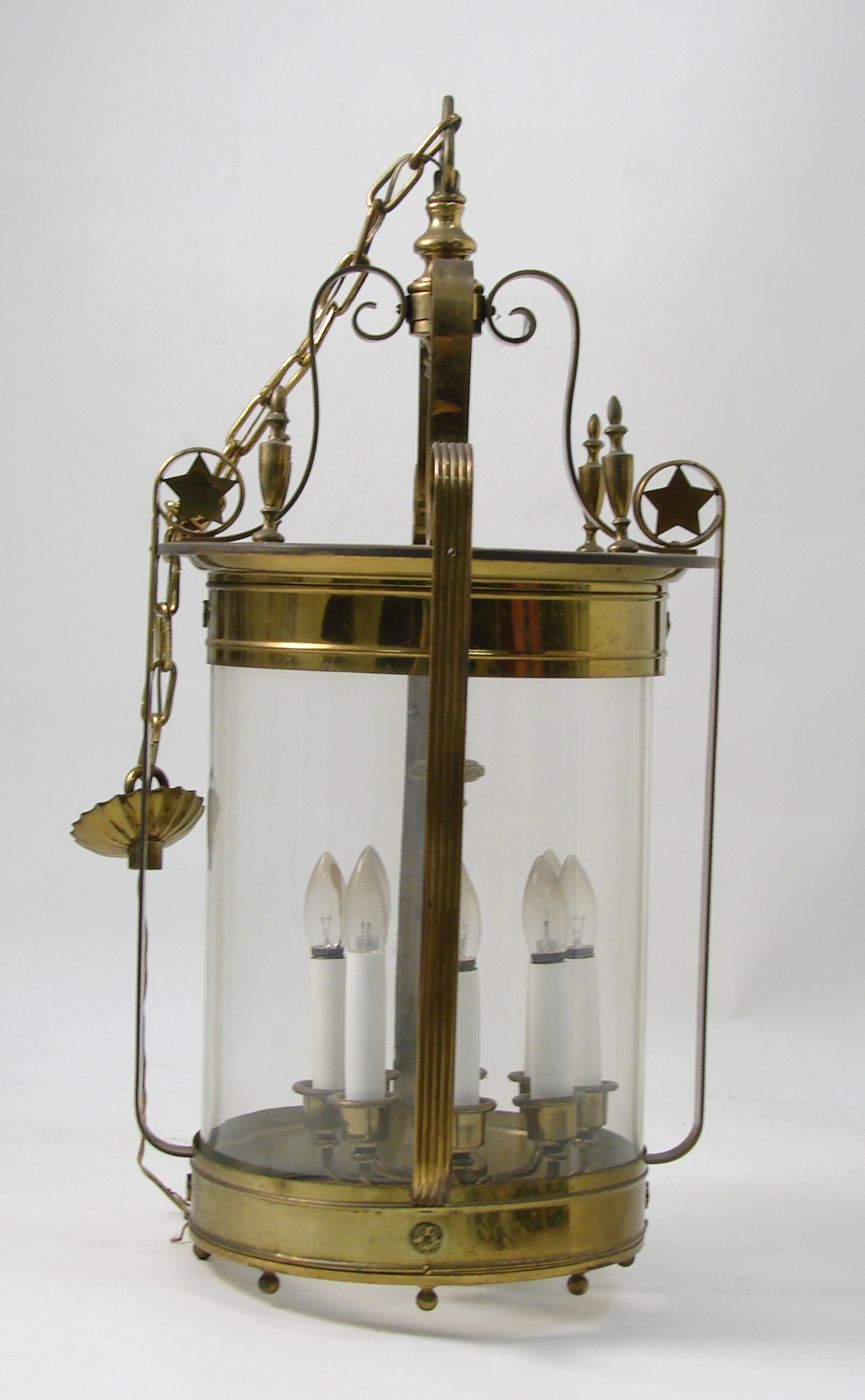 Appraisal: UNUSUAL CYLINDRICAL BRASS AND GLASS CHANDELIER With eight lights Taken