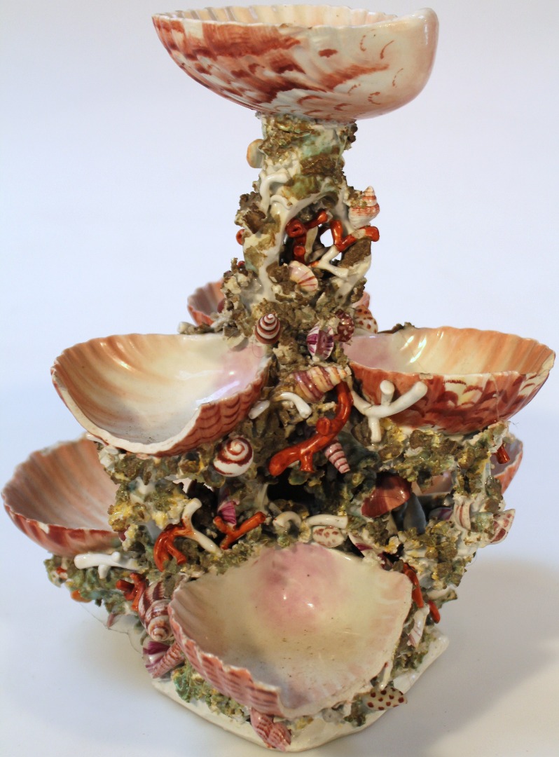 Appraisal: An early thC porcelain oyster stand set with seven basket