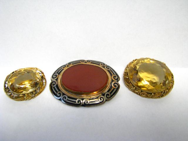 Appraisal: Three brooches including K yellow gold citrine approximately - ''